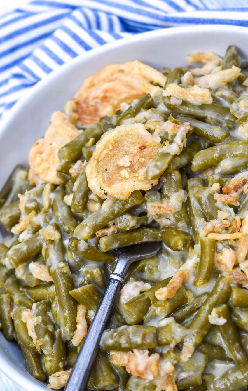 smoked green bean casserole in a shallow white serving bowl