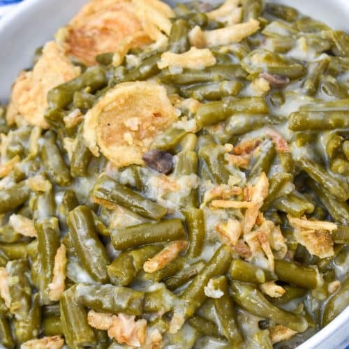 smoked green bean casserole in a shallow white serving bowl