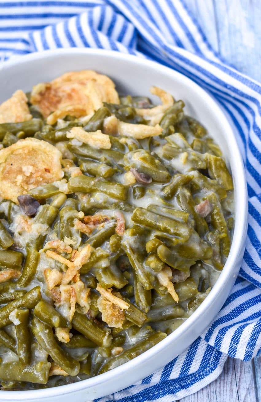 smoked green bean casserole in a shallow white serving bowl