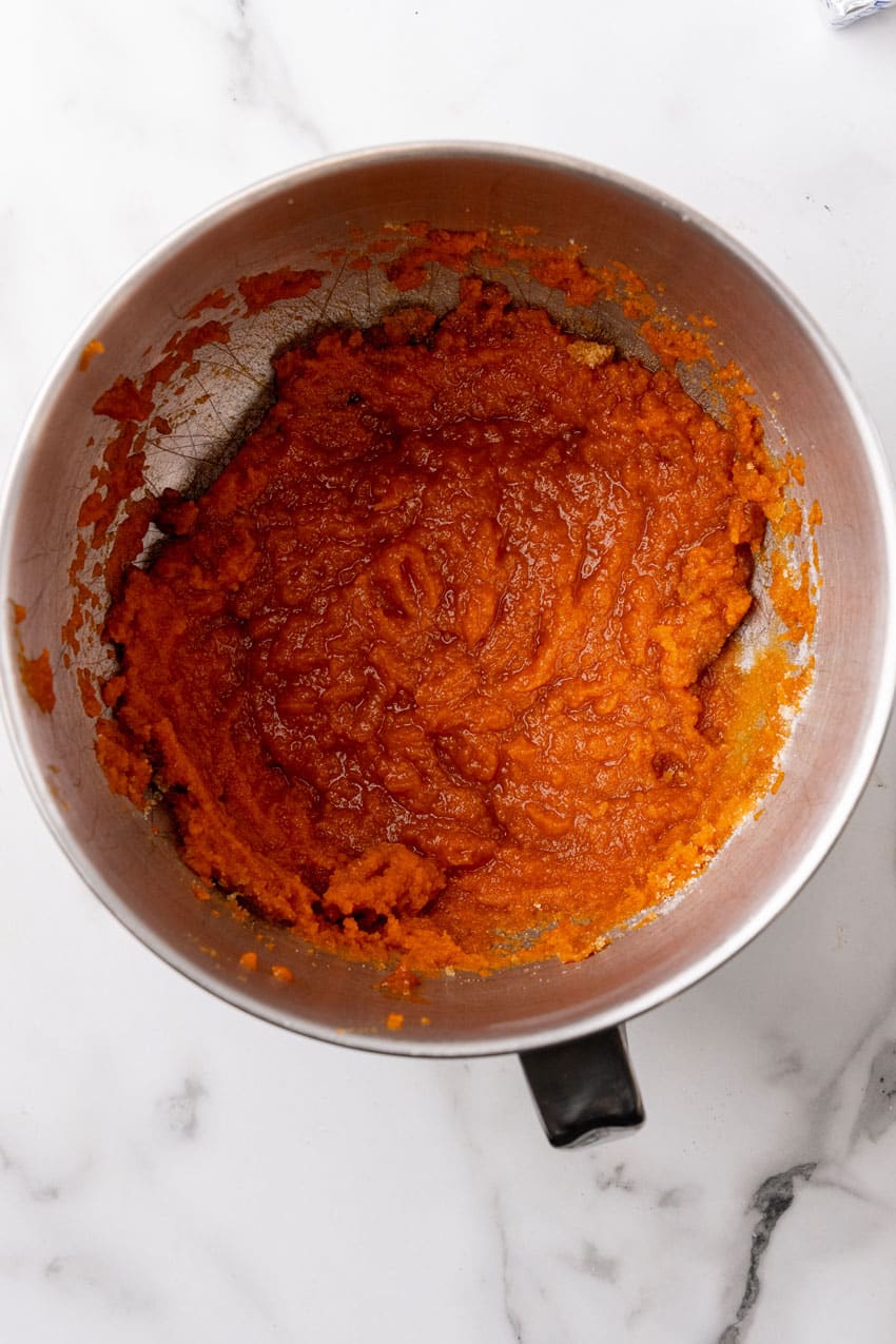 pumpkin muffin batter in a metal mixing bowl