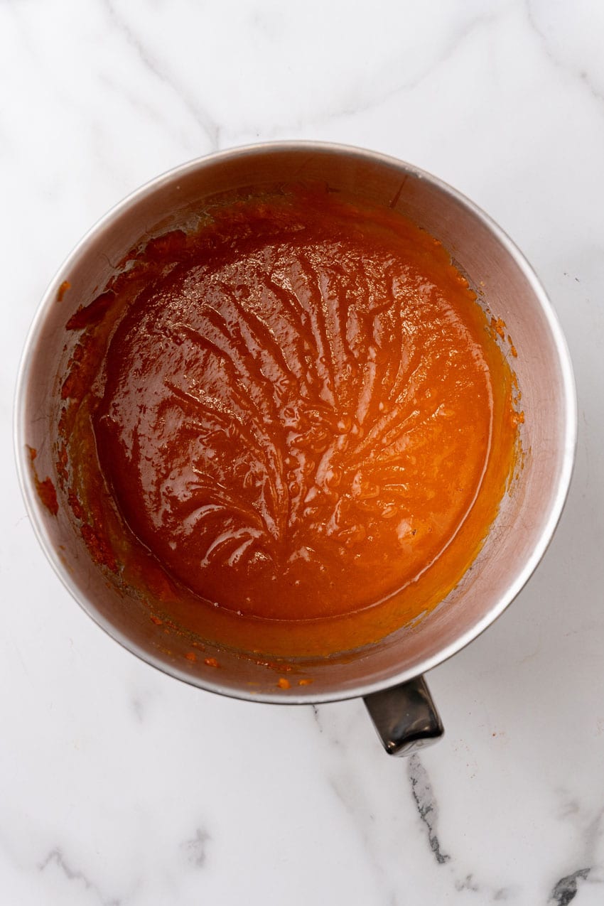 pumpkin muffin batter in a metal mixing bowl