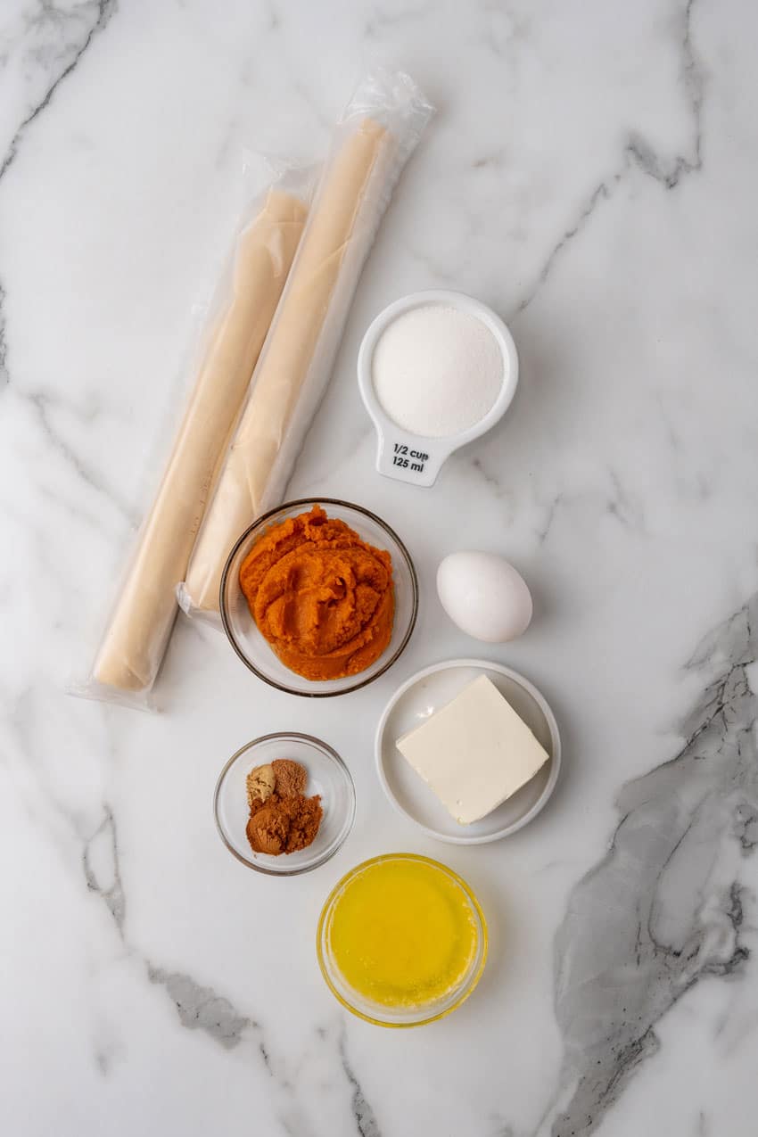 an overhead image showing the measured ingredients needed to make a batch of harry potter pumpkin pasties