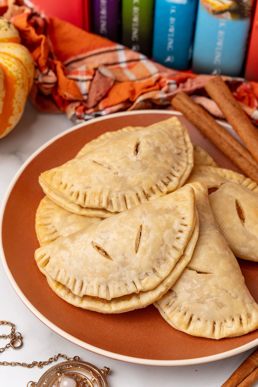 harry potter pumpkin pasties piled on an orange plate