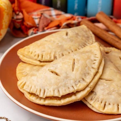 harry potter pumpkin pasties piled on an orange plate