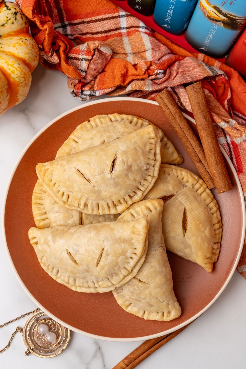 harry potter pumpkin pasties piled on an orange plate