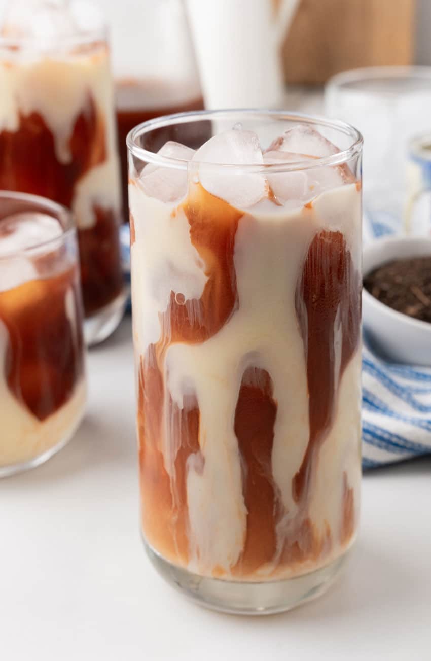 thai iced tea in a large glass with ice cubes