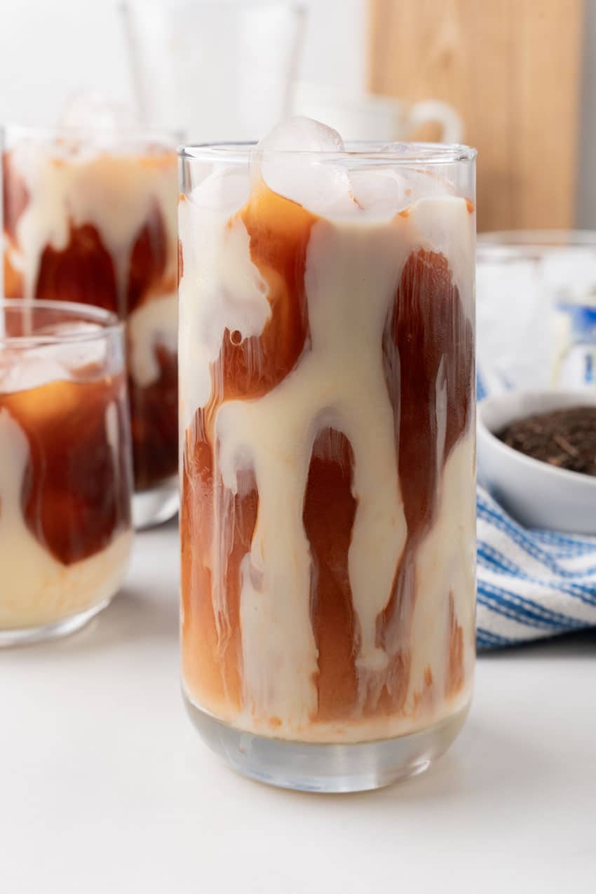 thai iced tea in a large glass with ice cubes