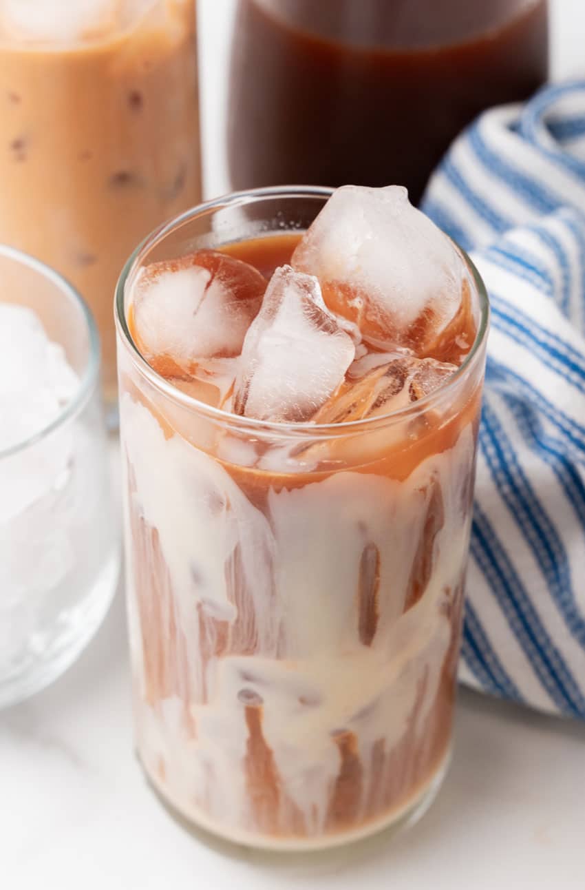 thai iced tea in a large glass with ice cubes