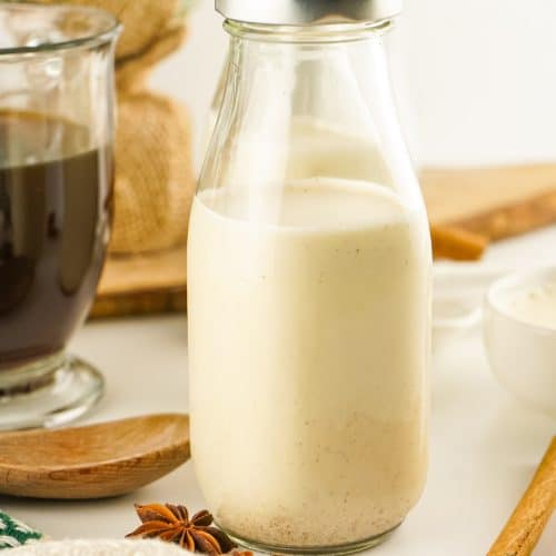 homemade eggnog coffee creamer in a small glass milk jar