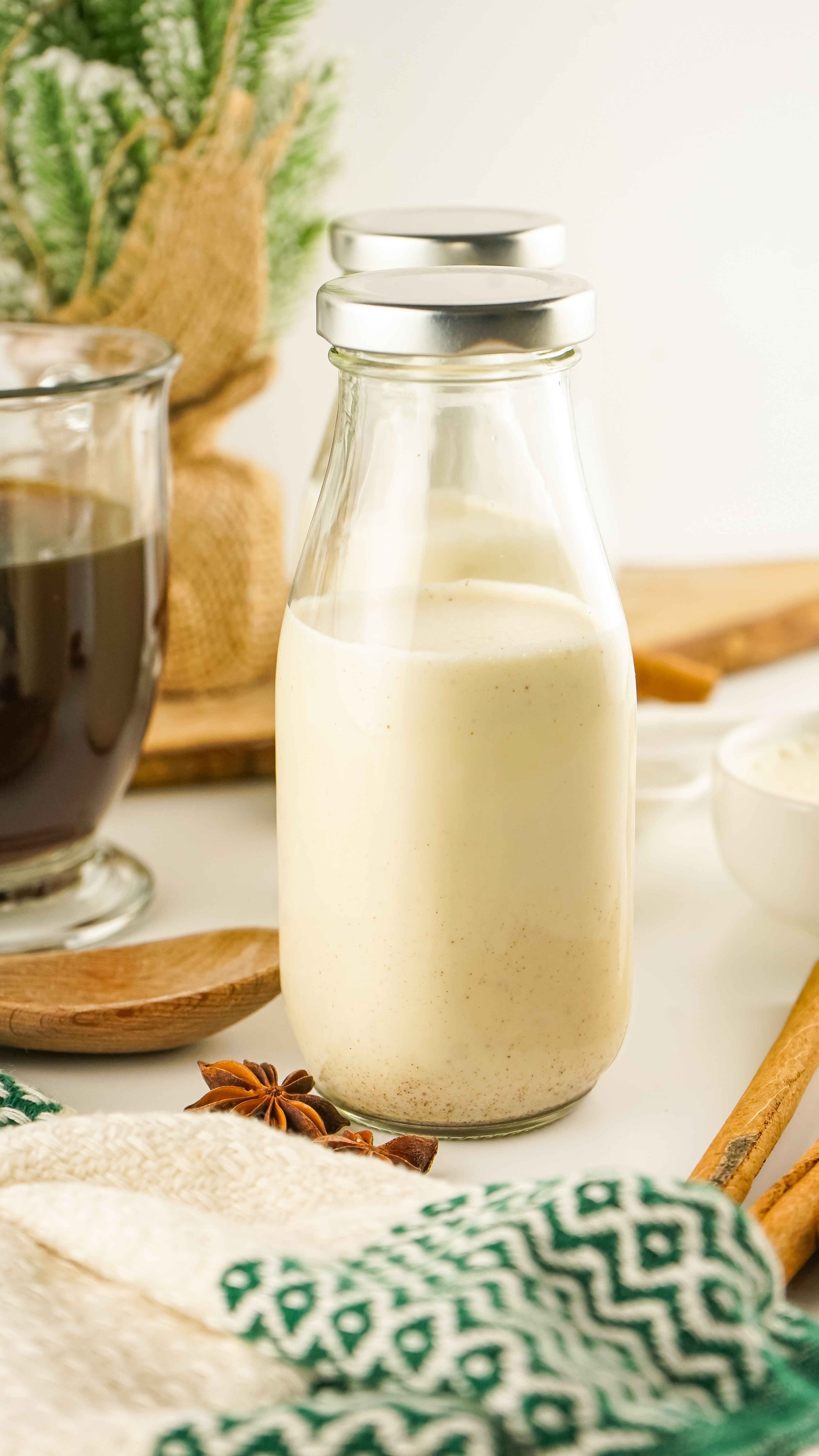 homemade eggnog coffee creamer in a small glass milk jar