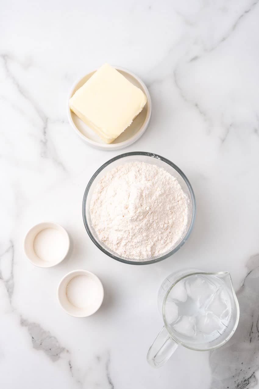 an overhead image showing the measured ingredients needed to make a batch of homemade puff pastry dough