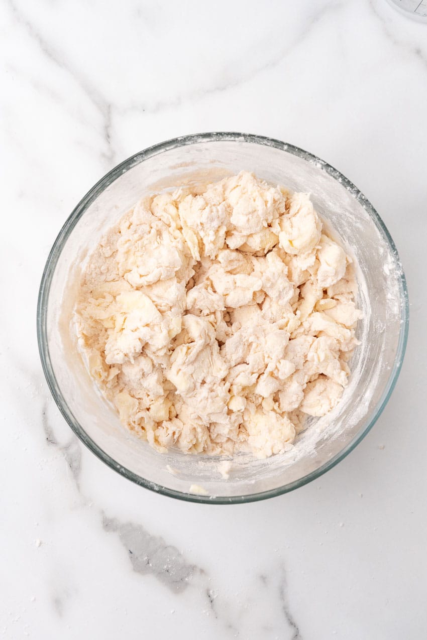 homemade puff pastry dough in a glass mixing bowl