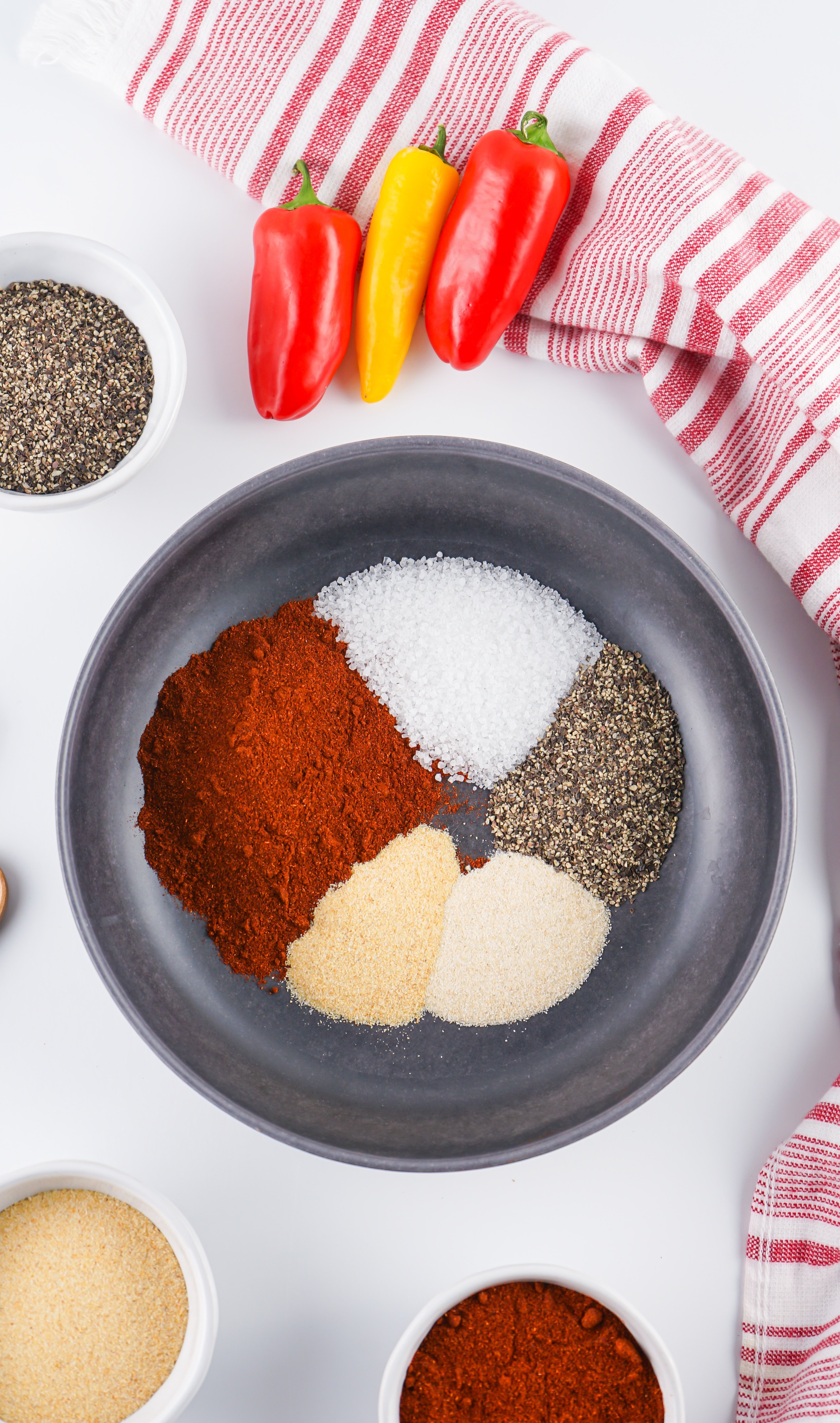 an overhead image showing the measured spices needed to make a batch of homemade barbecue rub