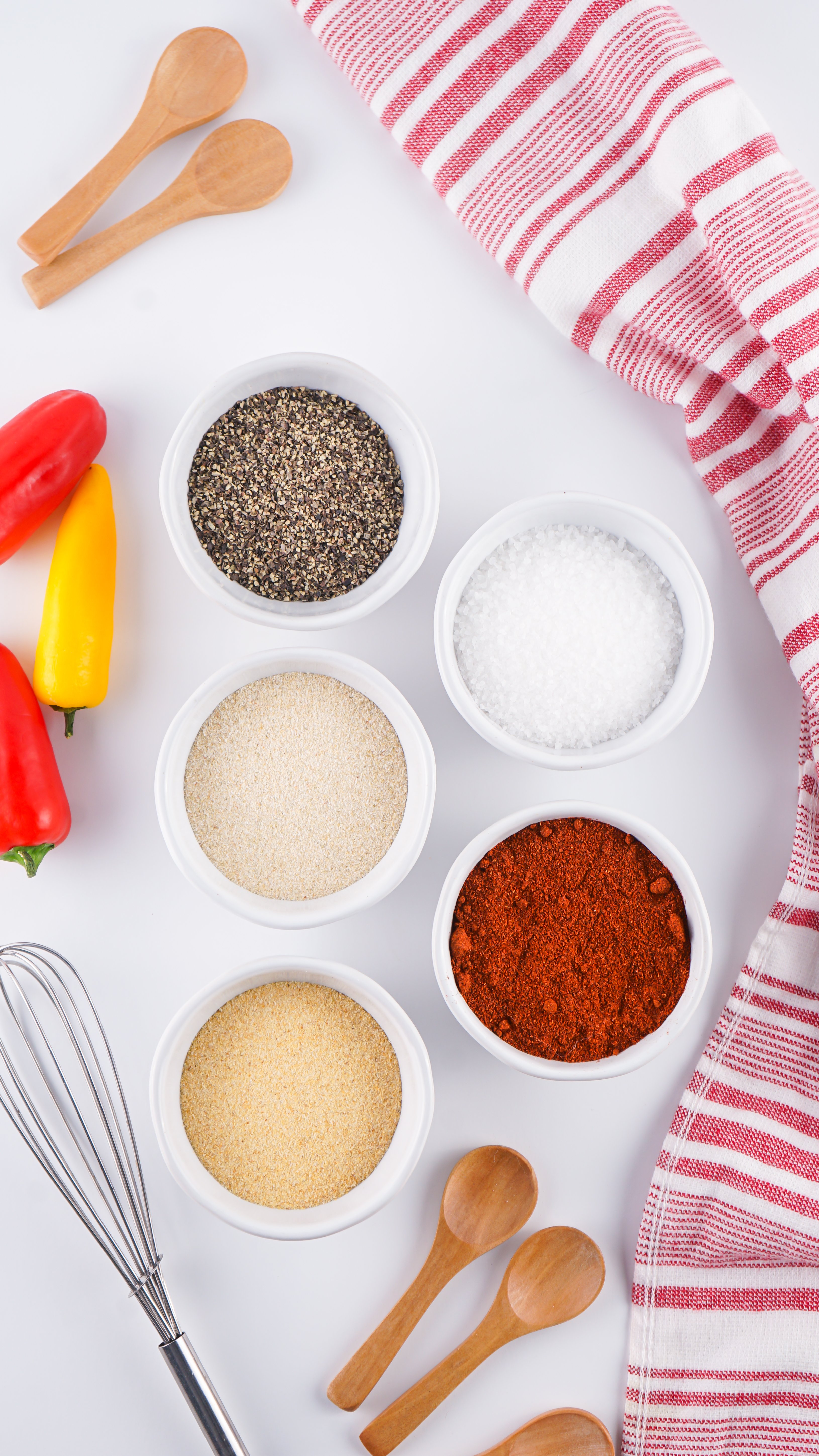 an overhead image showing the measured ingredients to make a batch of homemade barbecue rub