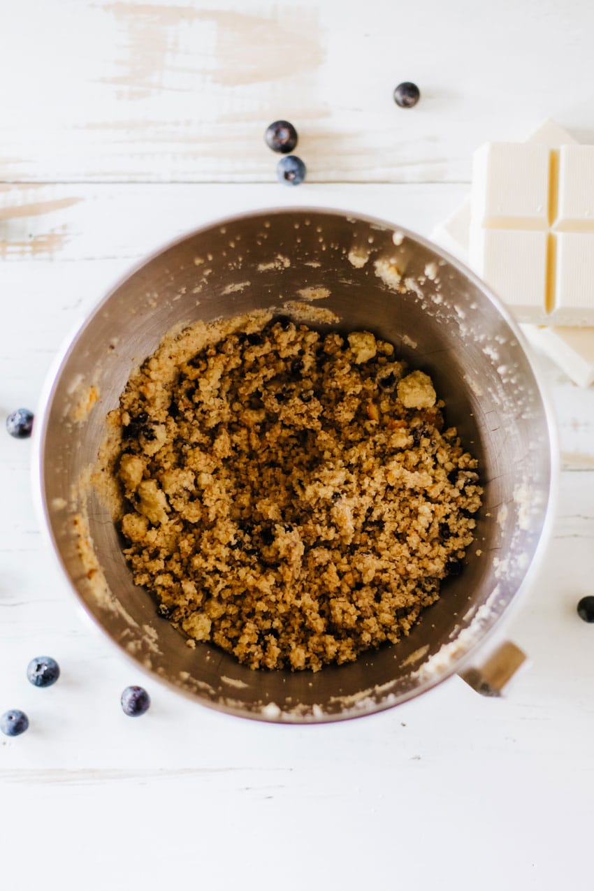 blueberry muffin crumbles in a metal mixing bowl