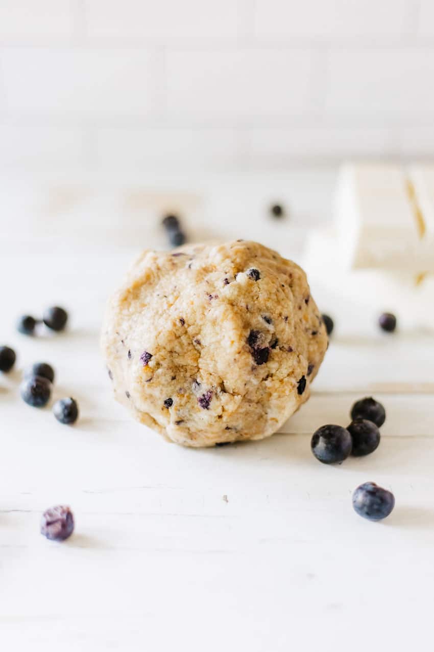 a ball of blueberry muffin cake pop mixture on a wooden table