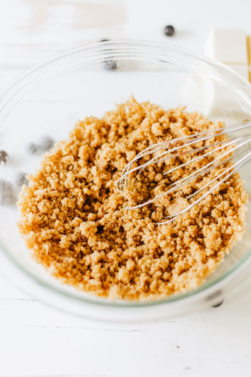 brown sugar crumble coating in a glass mixing ball