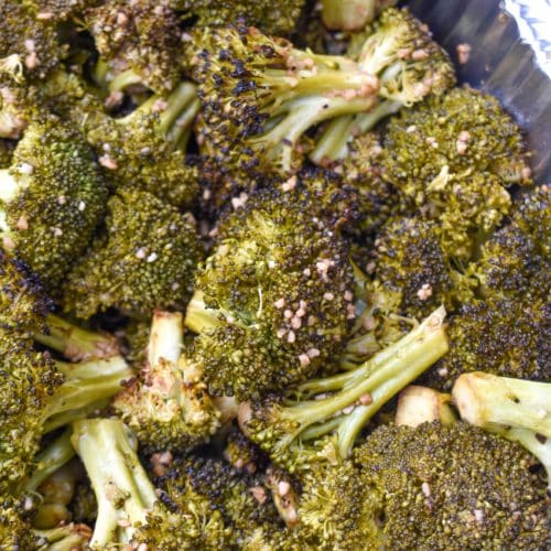 smoked broccoli recipe in an aluminum baking dish