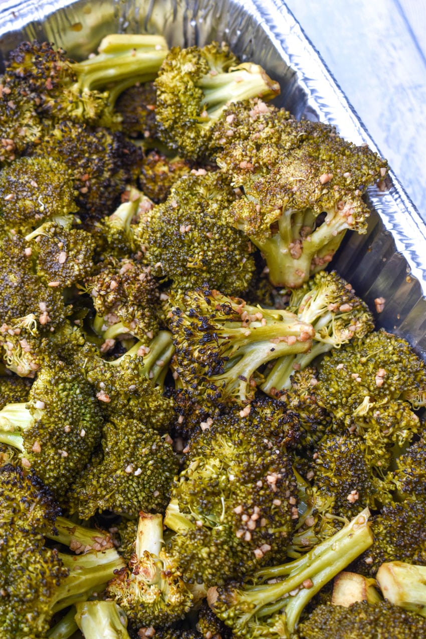 smoked broccoli recipe in an aluminum baking dish