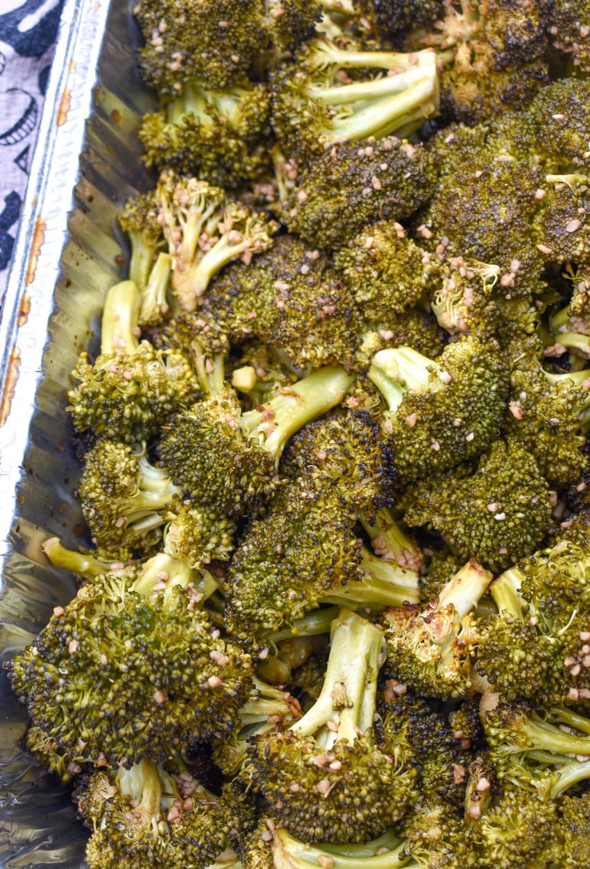 smoked broccoli recipe in an aluminum baking dish