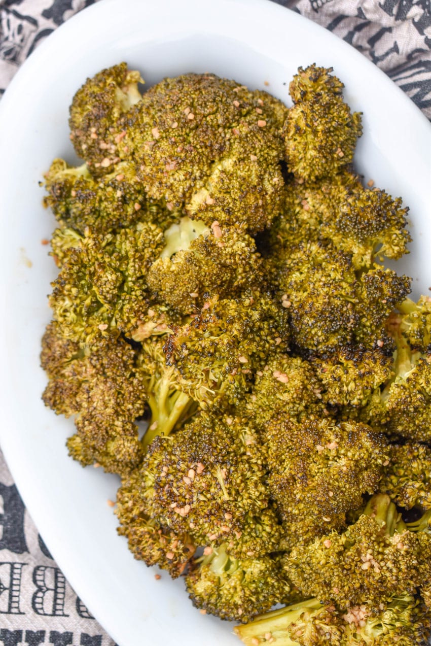 smoked broccoli in a white oval serving dish