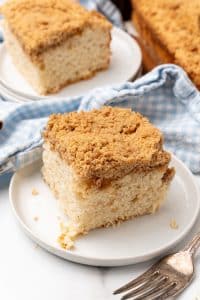 a slice of bisquick coffee cake on a small white dessert plate