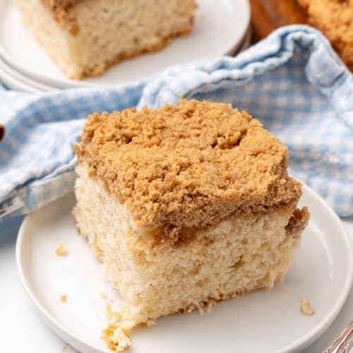 a slice of bisquick coffee cake on a small white dessert plate