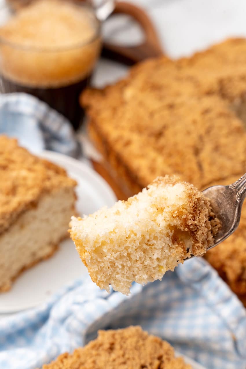 a silver fork holding up a scoop of homemade bisquick coffee cake