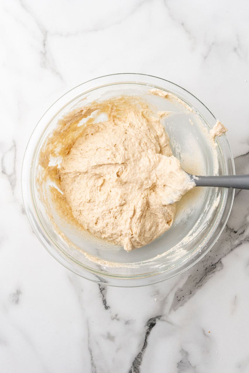 coffee cake batter in a glass mixing bowl