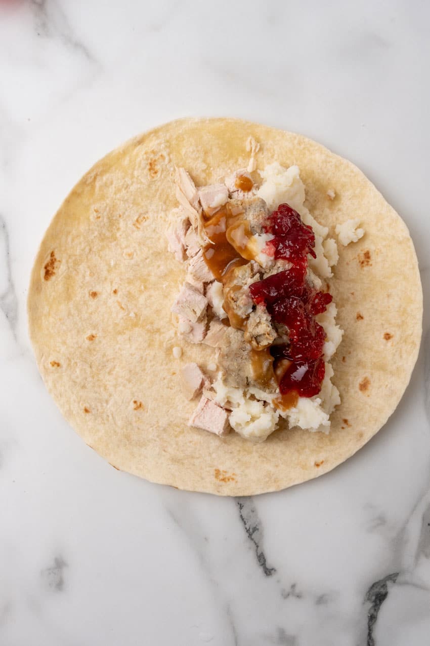 thanksgiving leftovers in the center of a flour tortilla