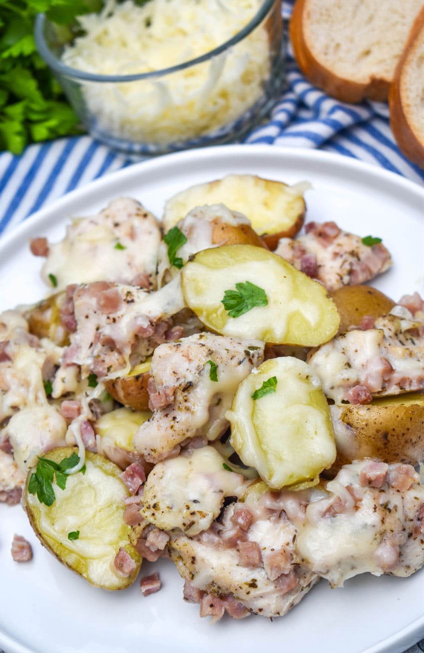 chicken cordon bleu foil packets served on a white dinner plate