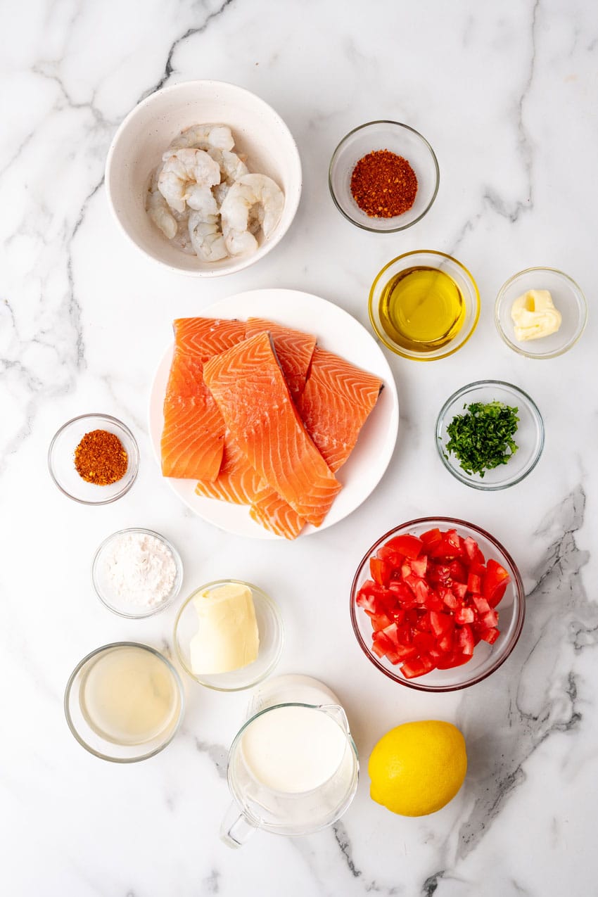 an overhead image showing the measured ingredients needed to make a batch of copycat red lobster salmon new orleans