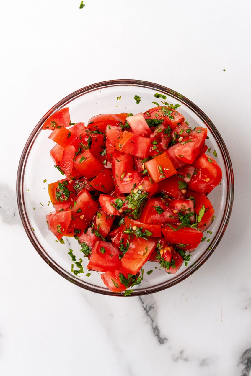 fresh tomato relish in a small glass bowl