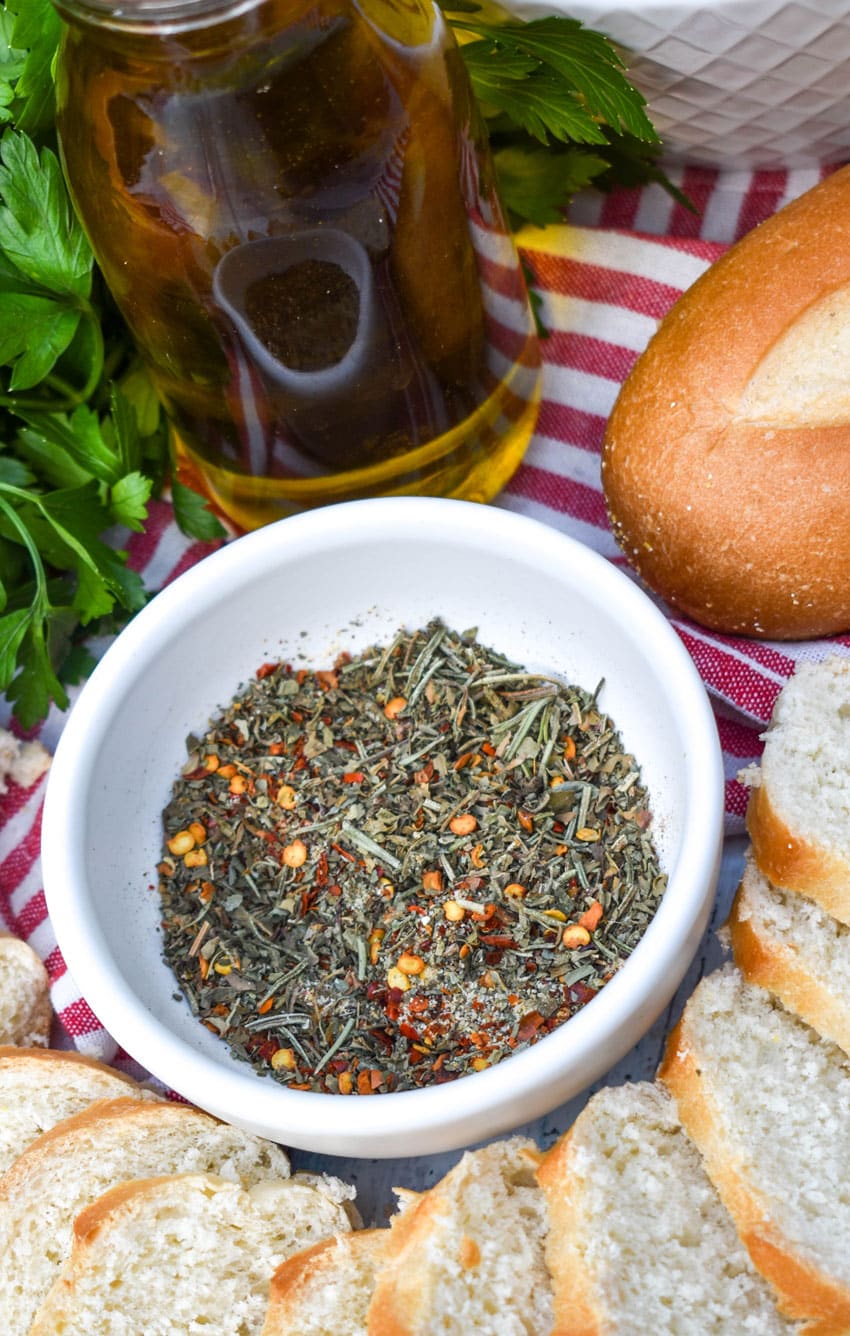 seasoning blend to make restaurant style bread dipping oil in a small white bowl