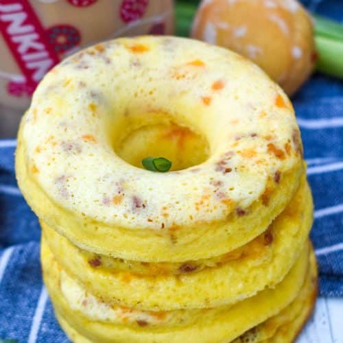 a stack of copycat dunkin donut omelet bites with a plastic cup of coffee in the background