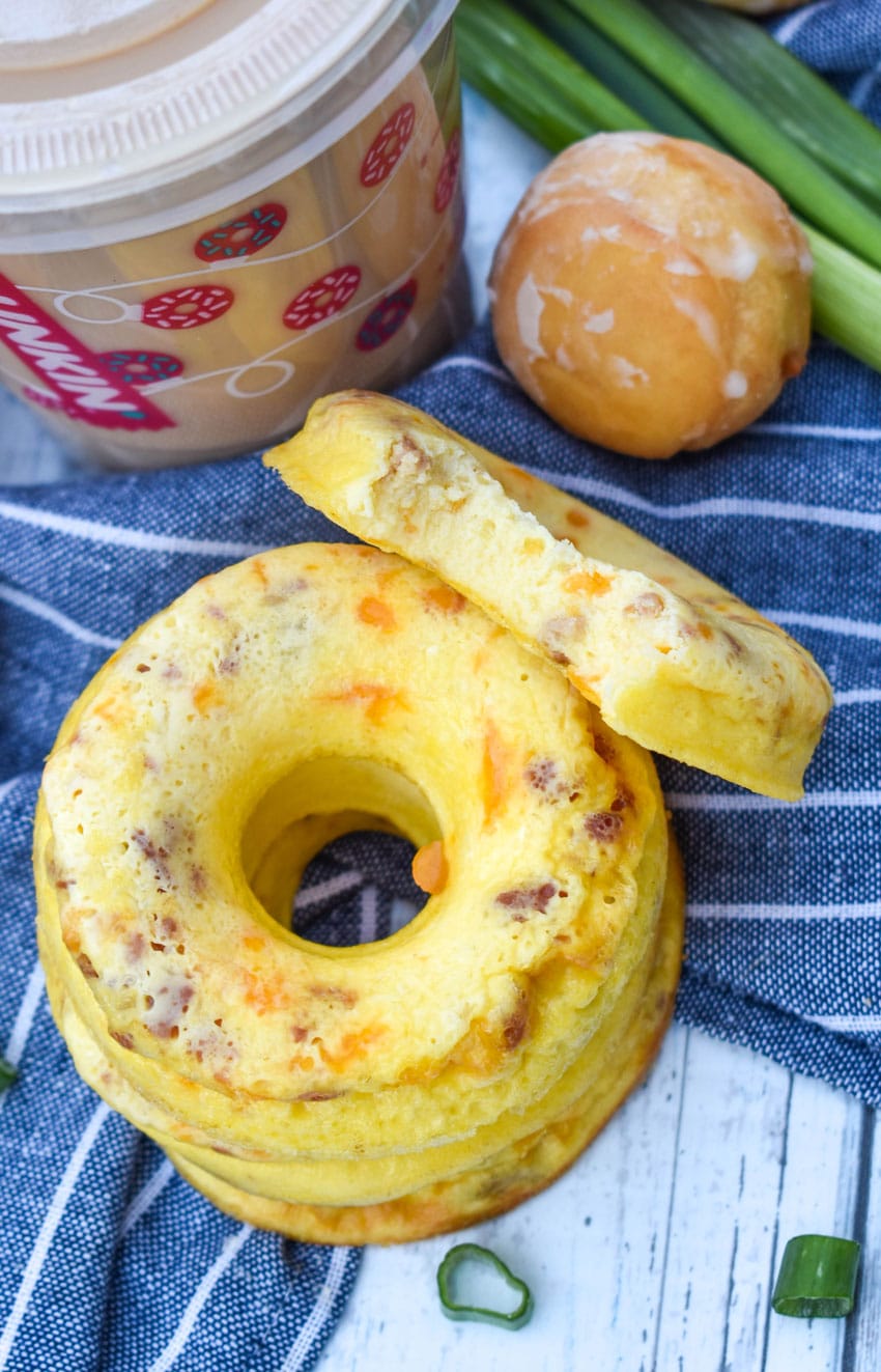 a stack of copycat dunkin donut omelet bites with a plastic cup of coffee in the background