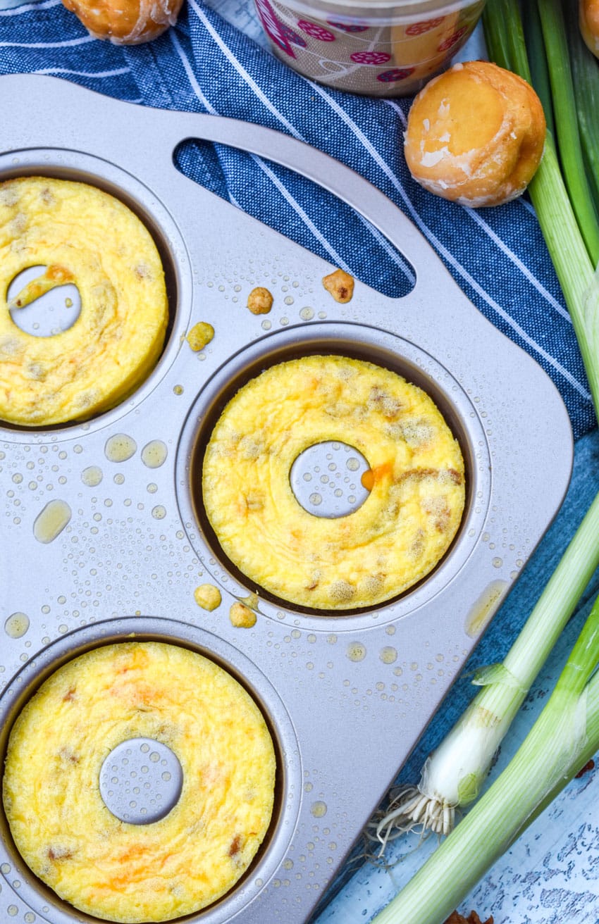 baked egg bites in a metal donut pan