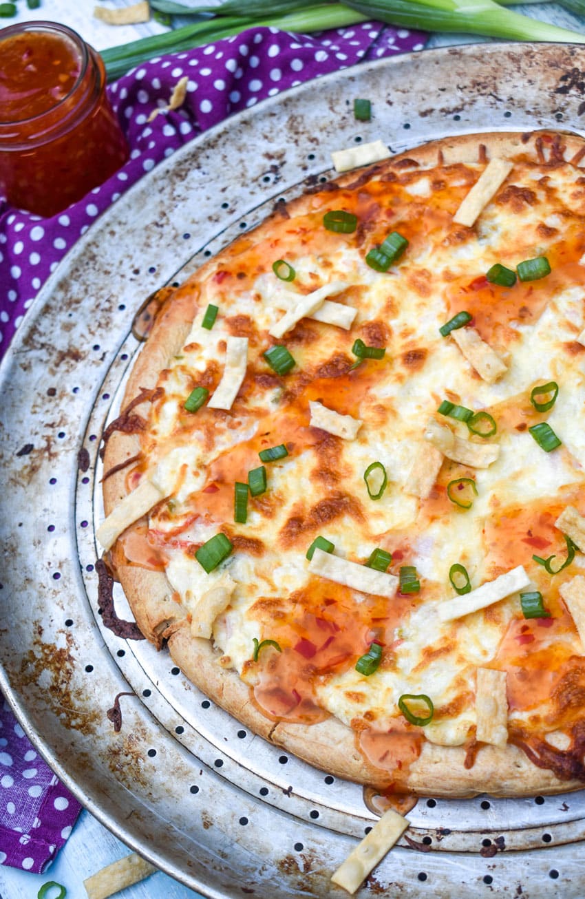 a crab rangoon pizza on a metal pizza pan