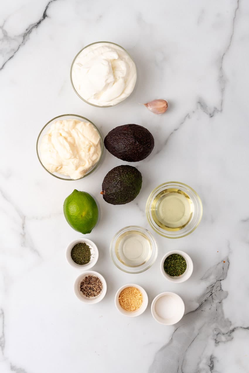 an overhead image showing the measured ingredients needed to make a batch of chick fil a avocado lime dressing