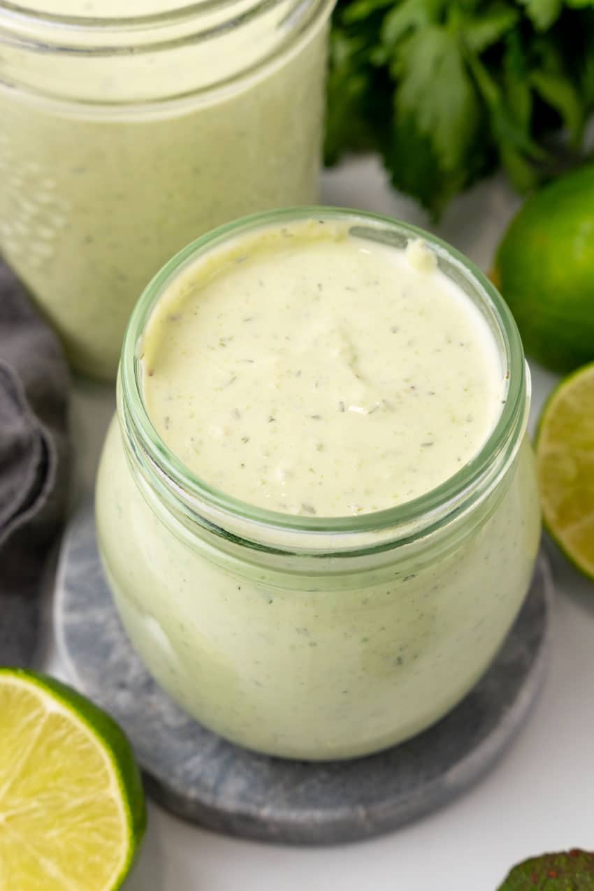 avocado lime dressing in small glass jars