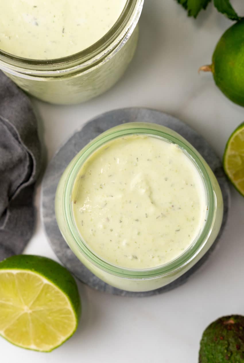 avocado lime dressing in small glass jars