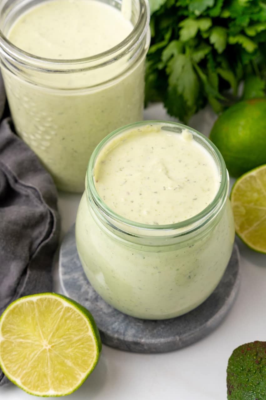 avocado lime dressing in small glass jars