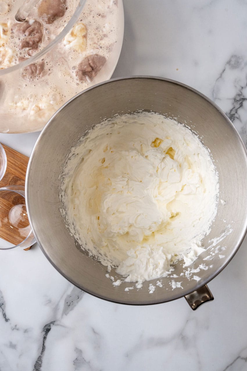 homemade whipped cream in a metal mixing bowl