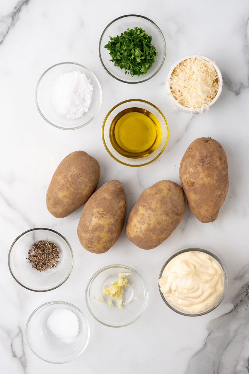 an overhead image showing the measured ingredients needed to make a batch of Parmesan truffle fries with garlic aioli