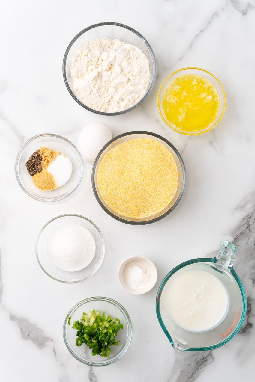 an overhead image showing the measured ingredients needed to make a batch of air fryer hushpuppies