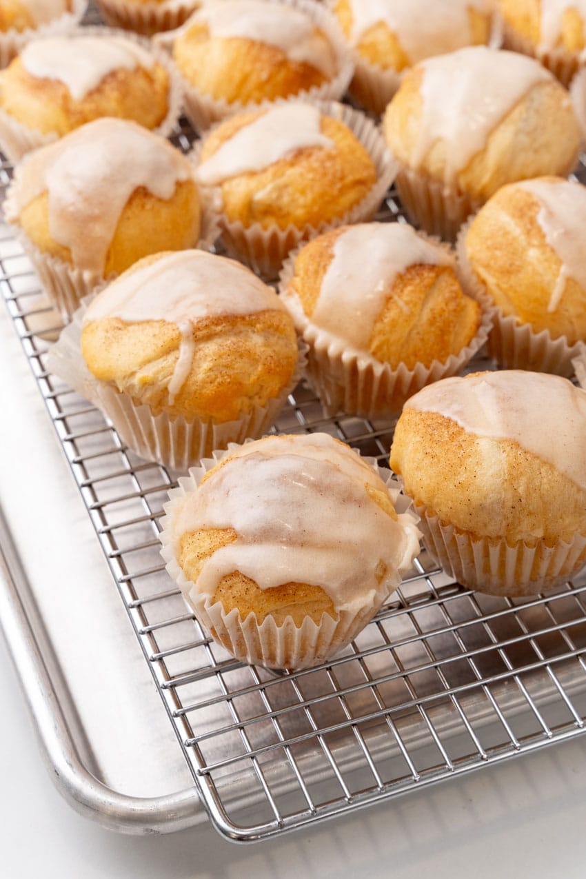 glazed resurrection rolls cooling on a metal wire rack