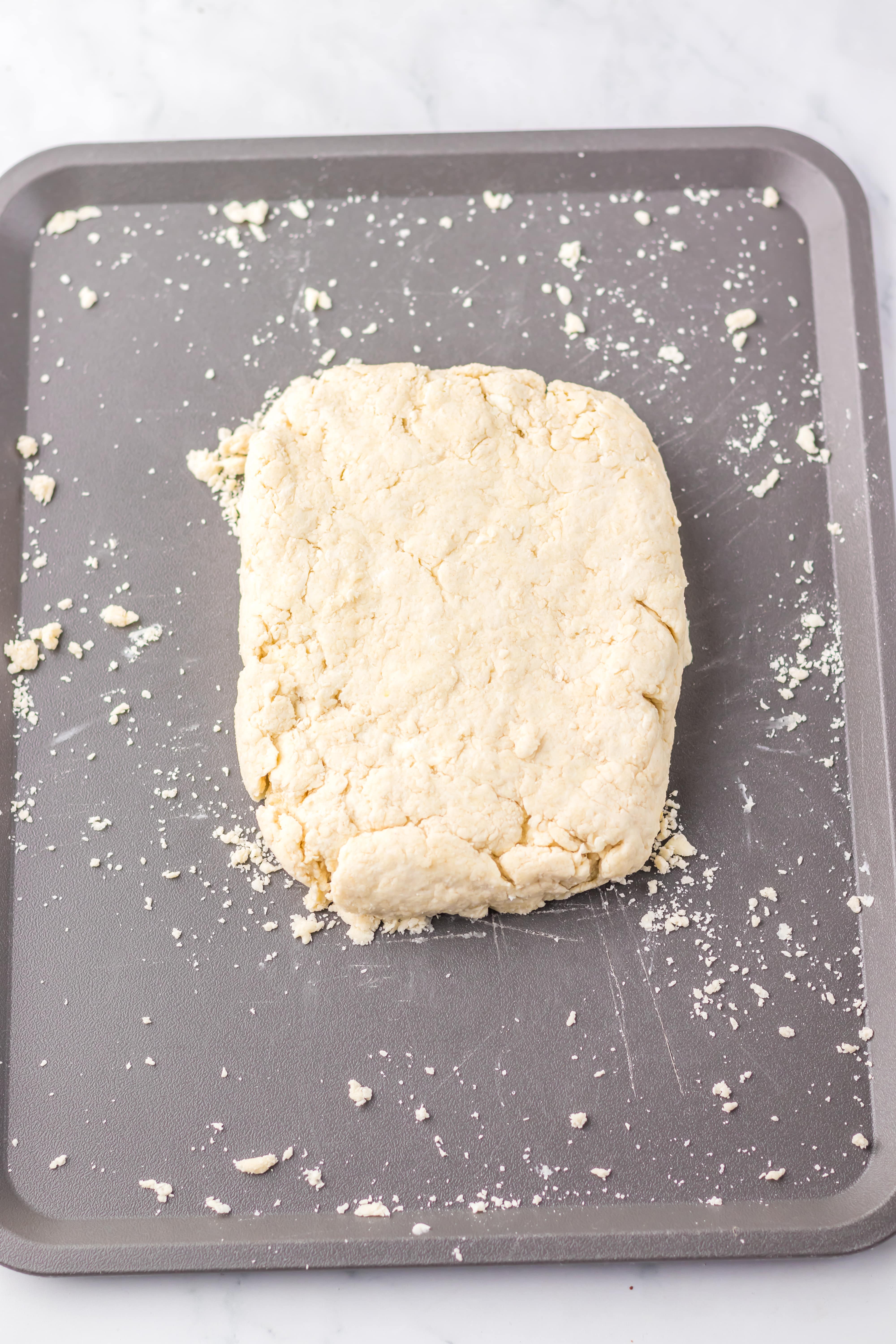 homemade country biscuit dough on a metal sheet pan