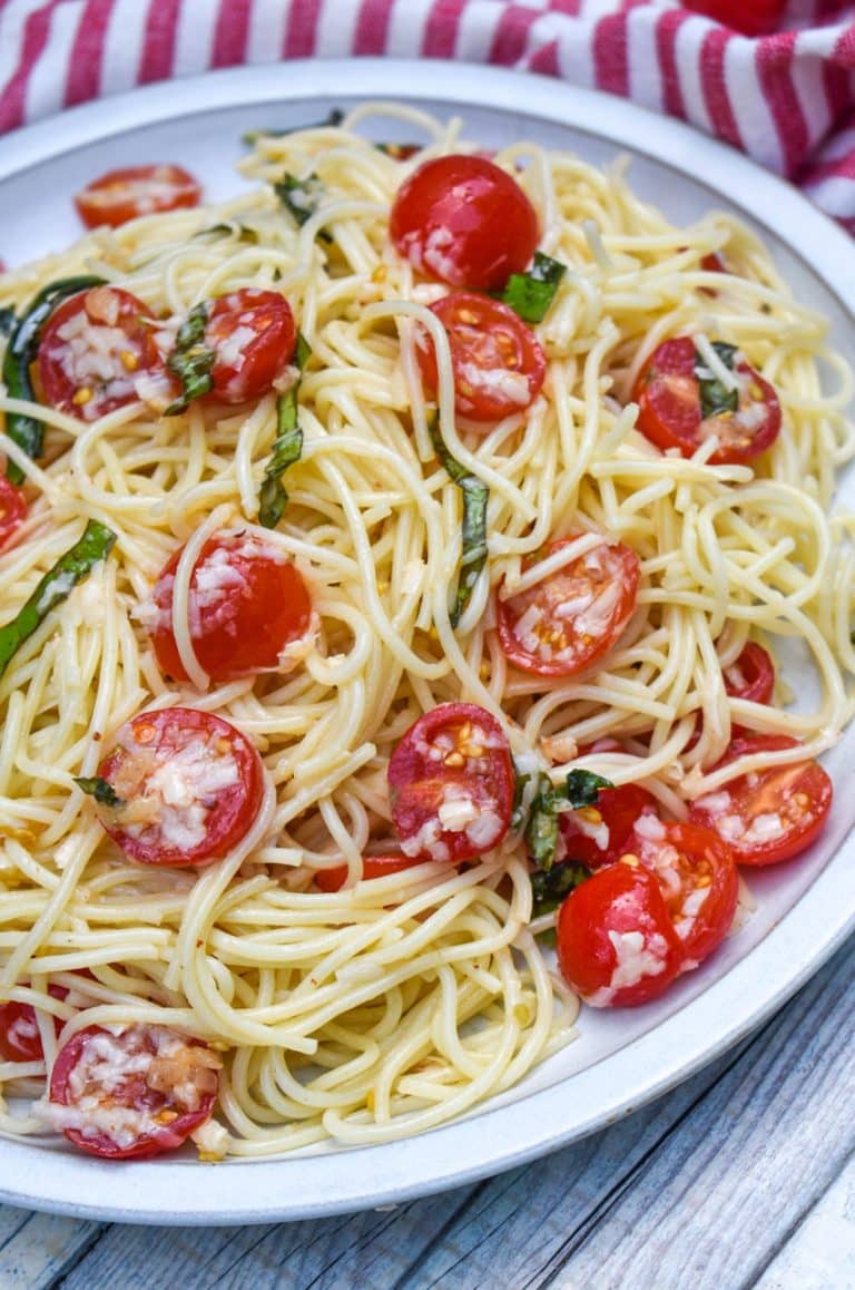 fresh summer spaghetti salad on a white dinner plate
