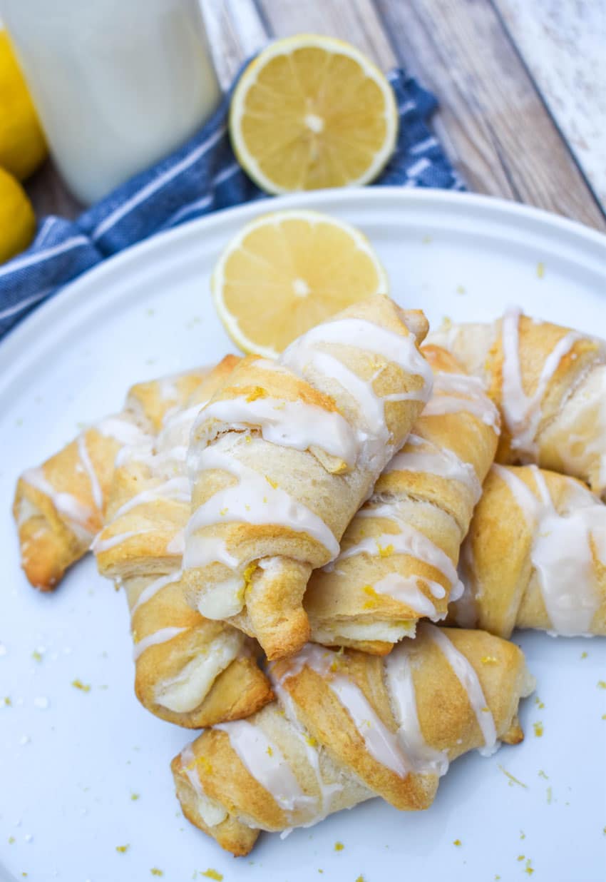 lemon cheesecake crescent rolls piled on a white dinner plate