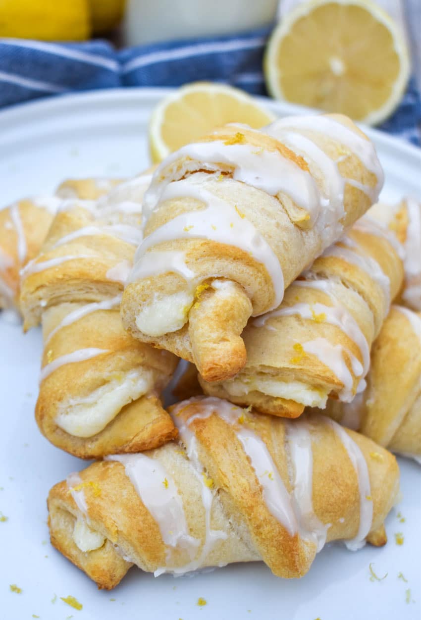 lemon cheesecake crescent rolls piled on a white dinner plate
